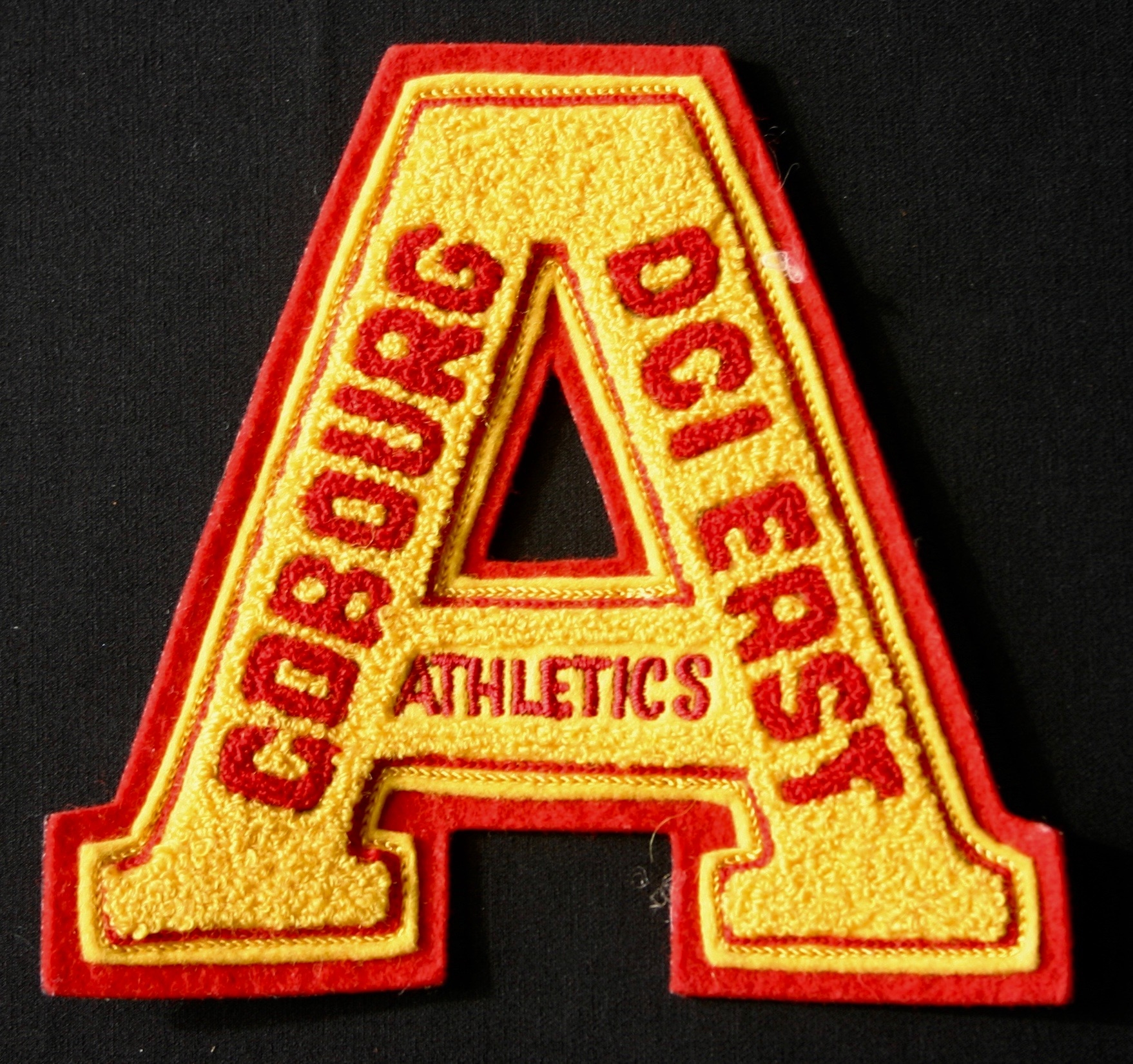 Cobourg DCI East Athletics crest