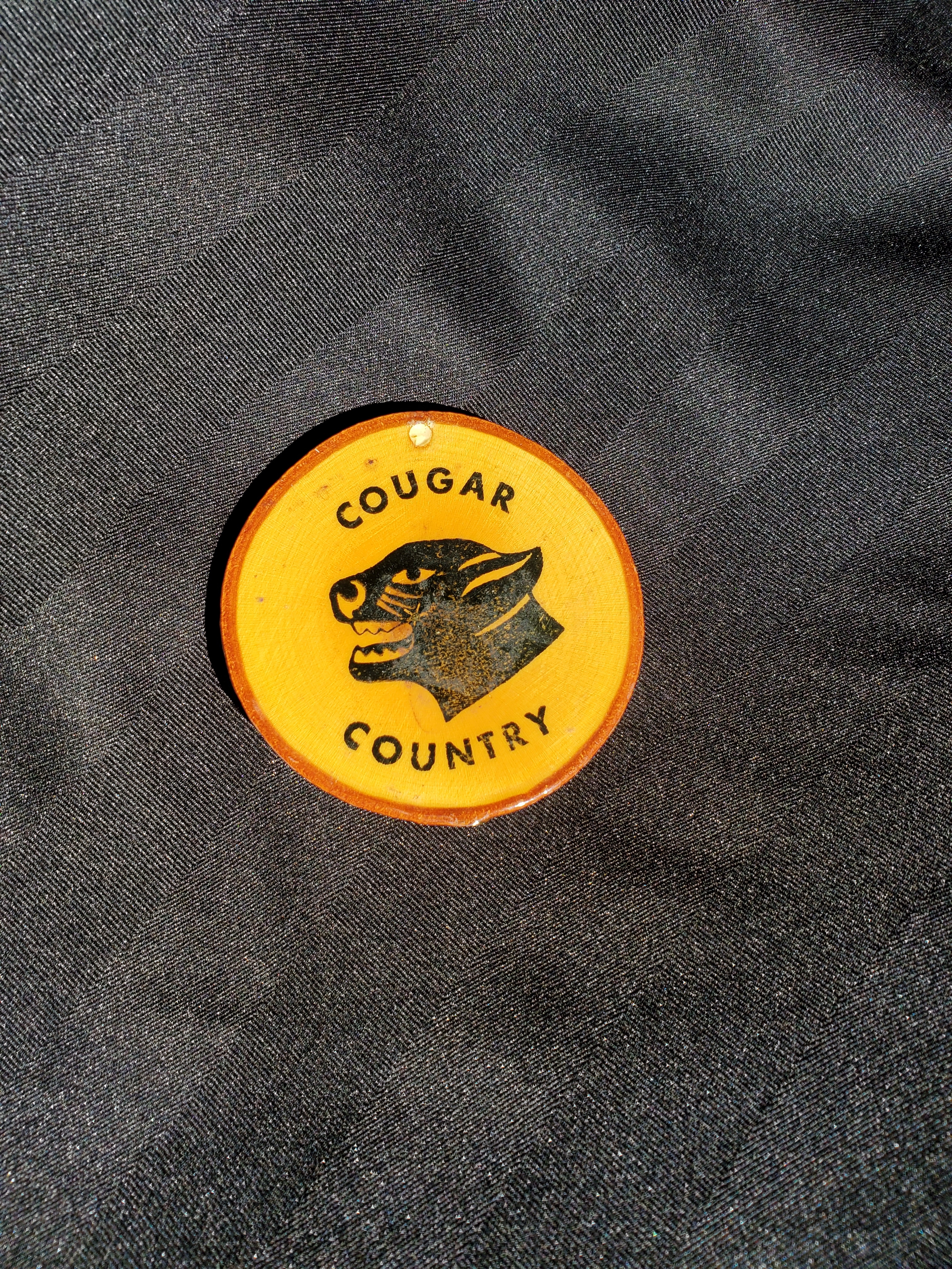 Cobourg Cougar logoed wooden coaster