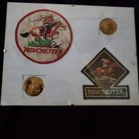 Winchester items on pressboard-2 crests & 2 inlays