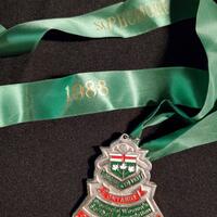 1988 Cobourg Junior Angels silver medallion-green lanyard