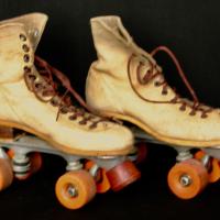 Roller skates with orange nylon wheels