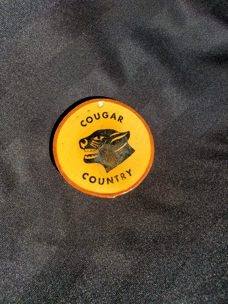 Cobourg Cougar logoed wooden coaster