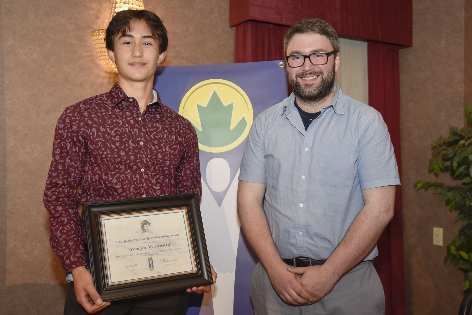 Brendan Woodward receives Award certificate from Patrick Quigley