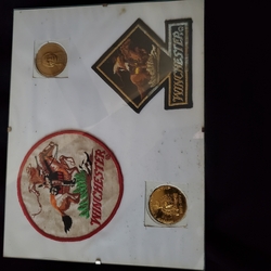 Winchester items on pressboard-2 crests & 2 inlays