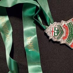 1988 Cobourg Junior Angels silver medallion-green lanyard