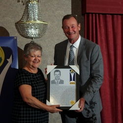 Steve Smith receives certificate from Liz Basinger