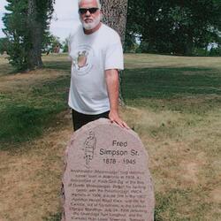 2020 Fred Simpson 1878-1945 gravestone photo at Alderville- grandson Dave Mowat standing